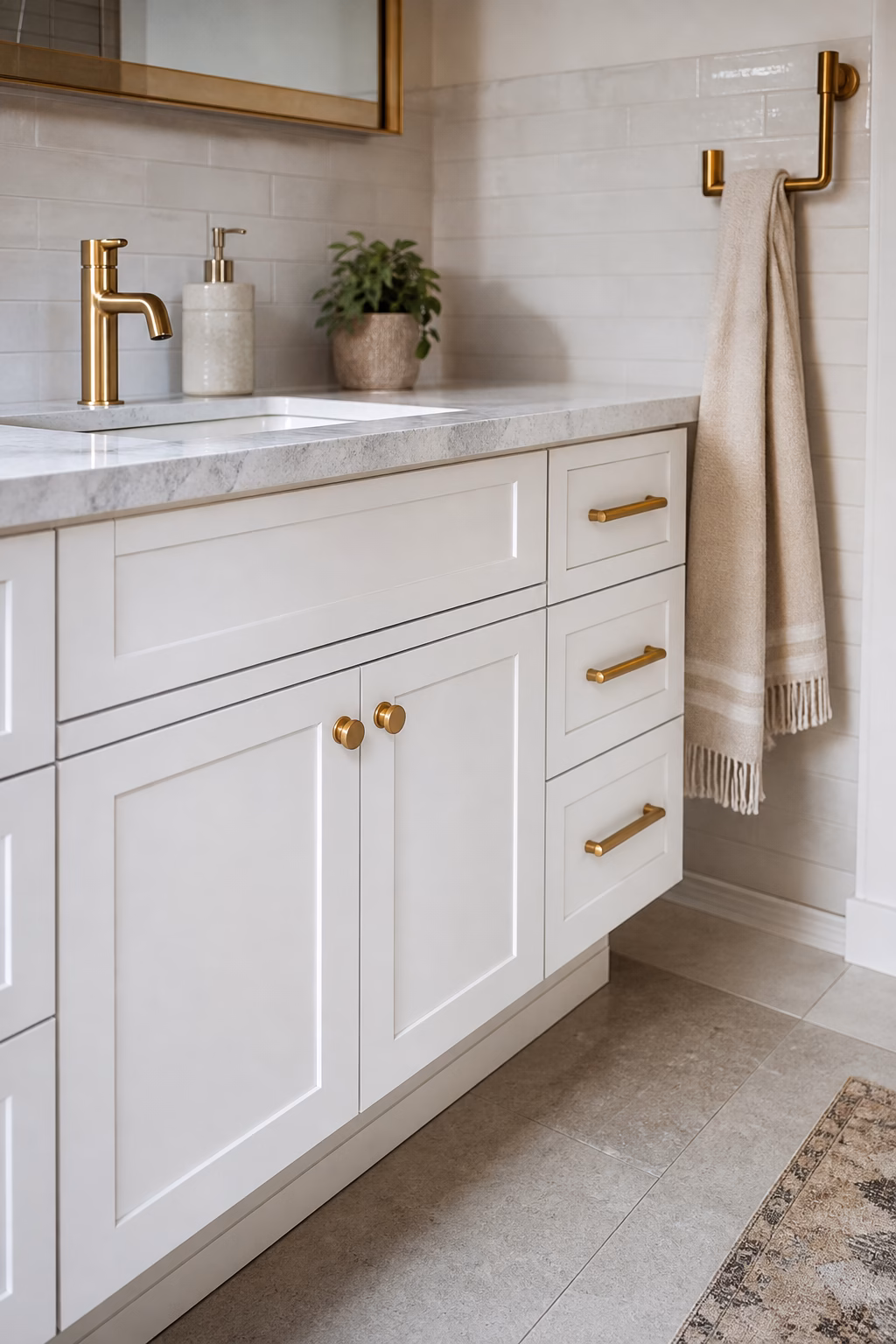 Polished bathroom counter with ceramic soap pump, covered cotton jar, tray, and uncluttered sink