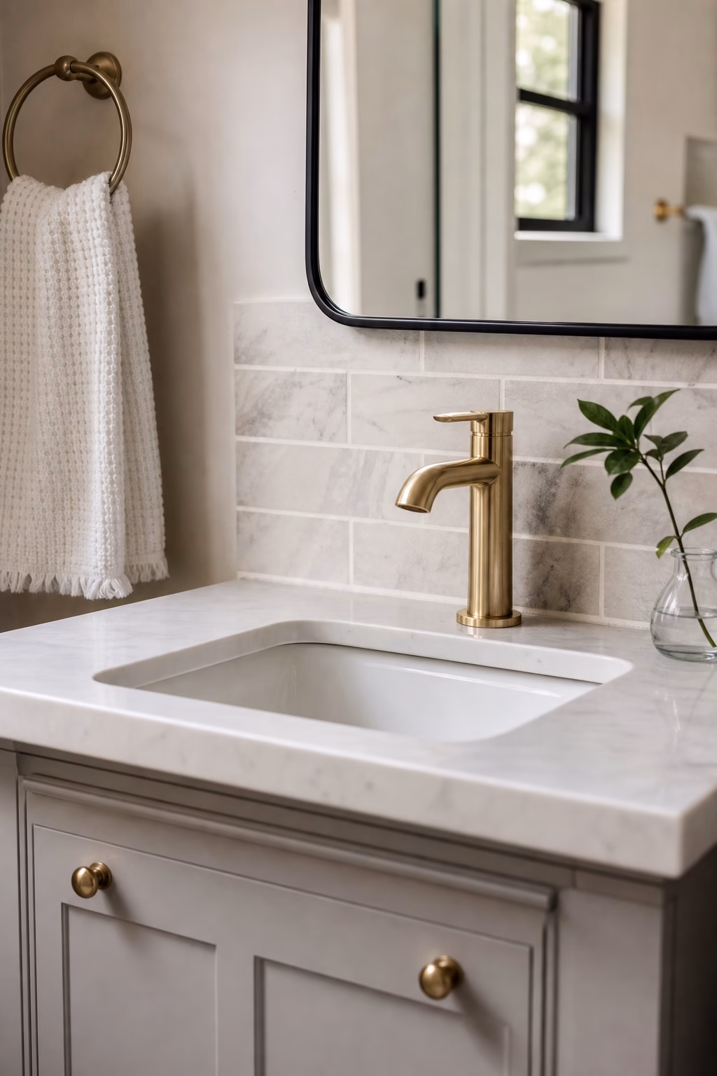 Bathroom vanity with new brushed nickel faucet, matching drain trim, and stone counter