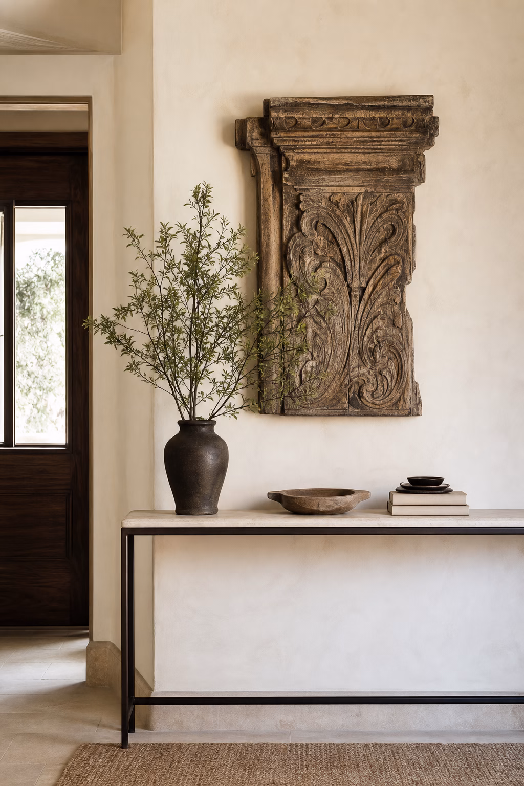 Salvaged carved wood fragment displayed as chic wall decor