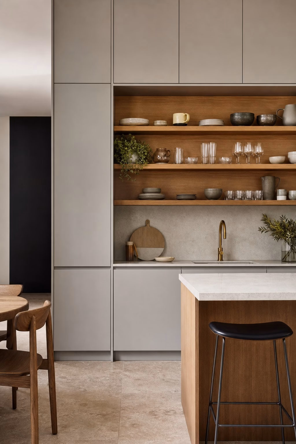 Stylish kitchen with closed cabinets and one open shelf zone with bowls, glassware, and ceramics