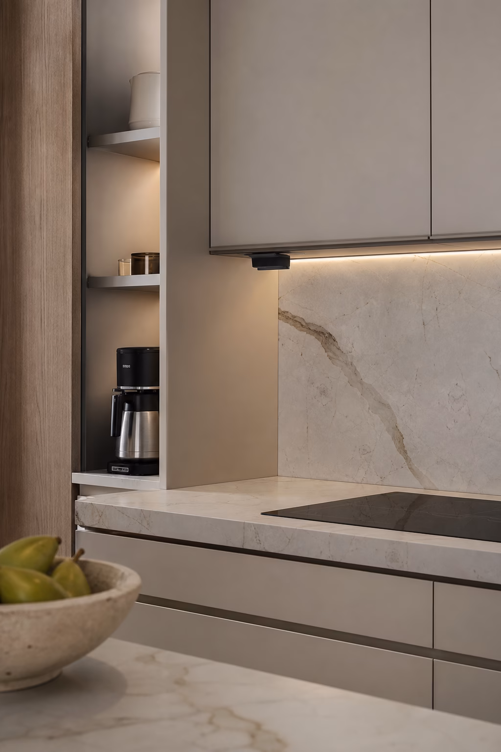 Discreet outlet planning preserving a clean modern kitchen backsplash