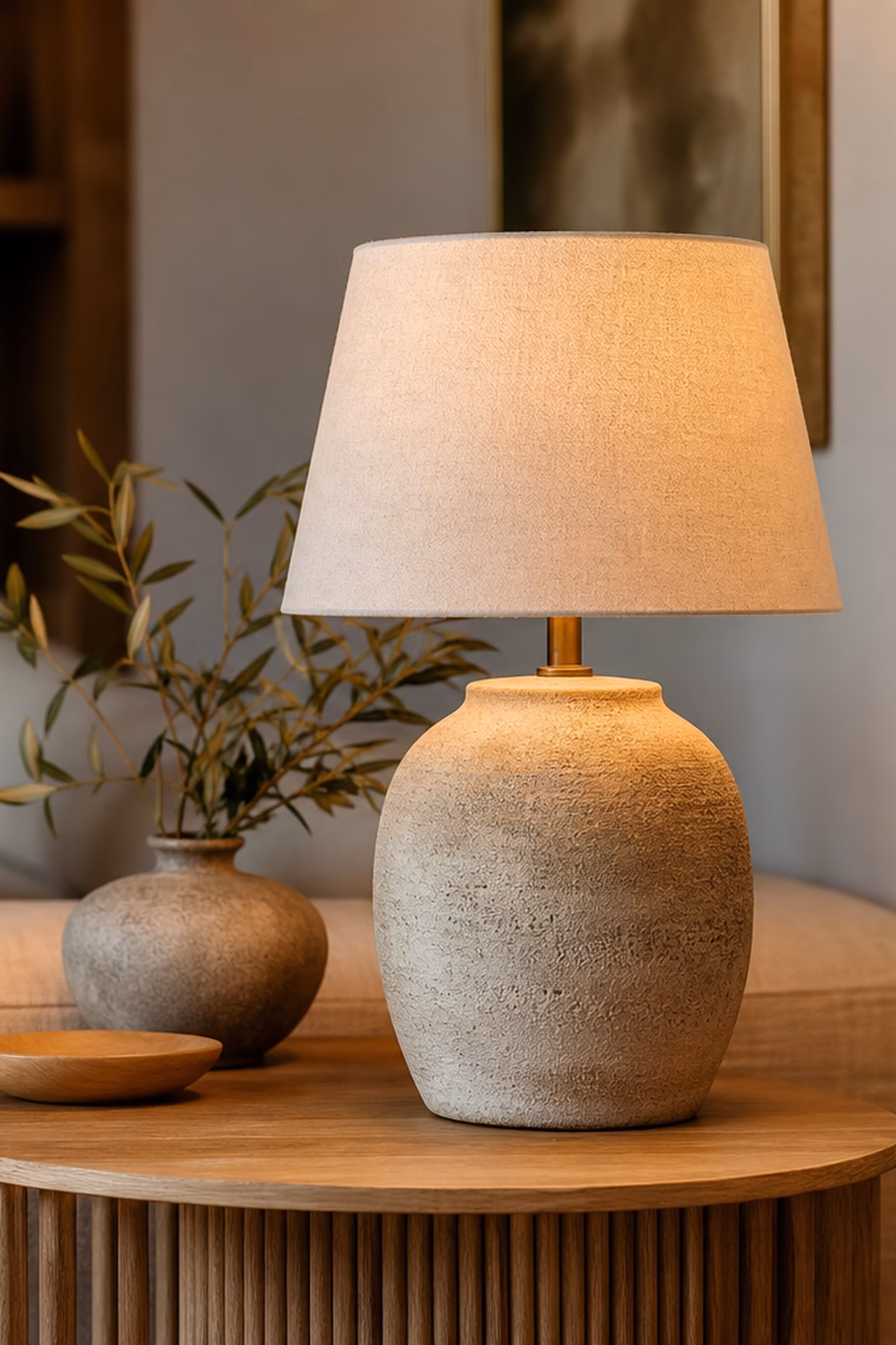 Textured ceramic table lamp styled on a living room side table.