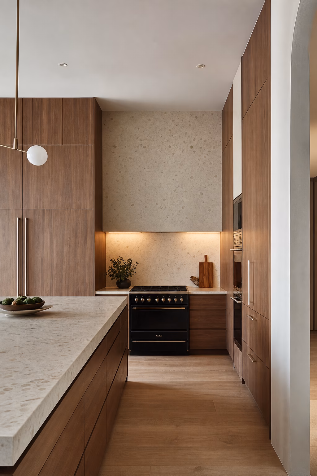 Minimalist kitchen remodel with tall pantry storage, deep drawers, and a clean open wall.