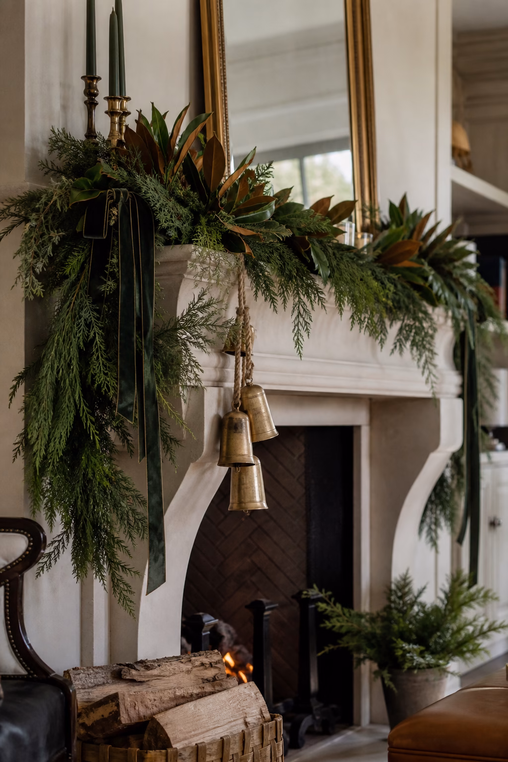 Lush holiday garland draped along a refined fireplace mantel