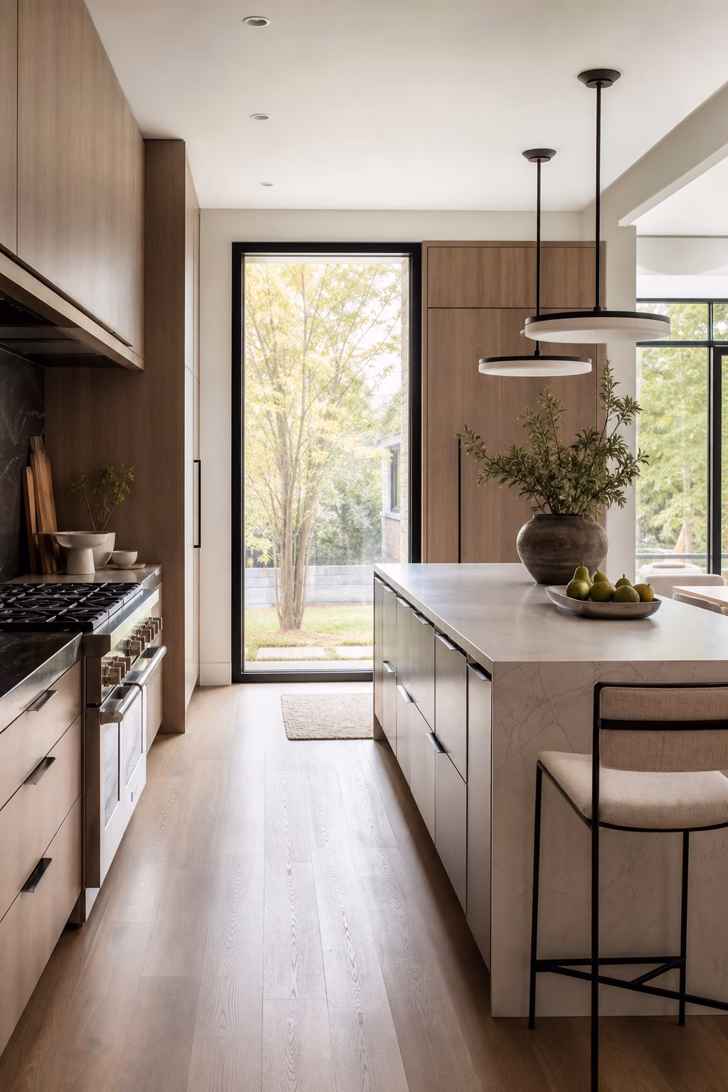 Elegant kitchen remodel with a slim functional island, deep drawers, and clear walkways.