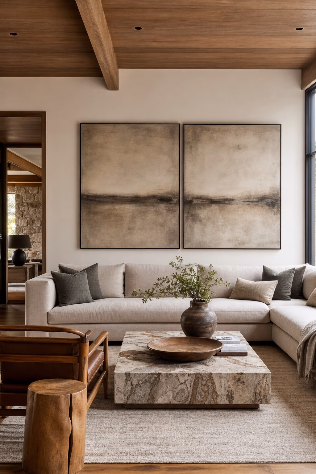 Two-panel diptych artwork stretching across a wide living room wall
