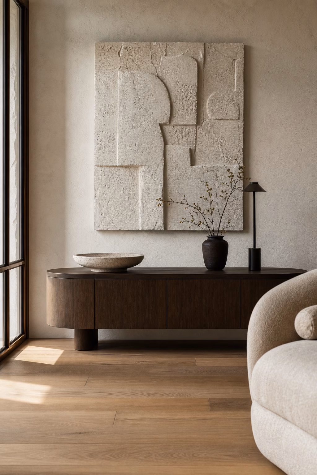Sculptural wall art displayed above a living room console
