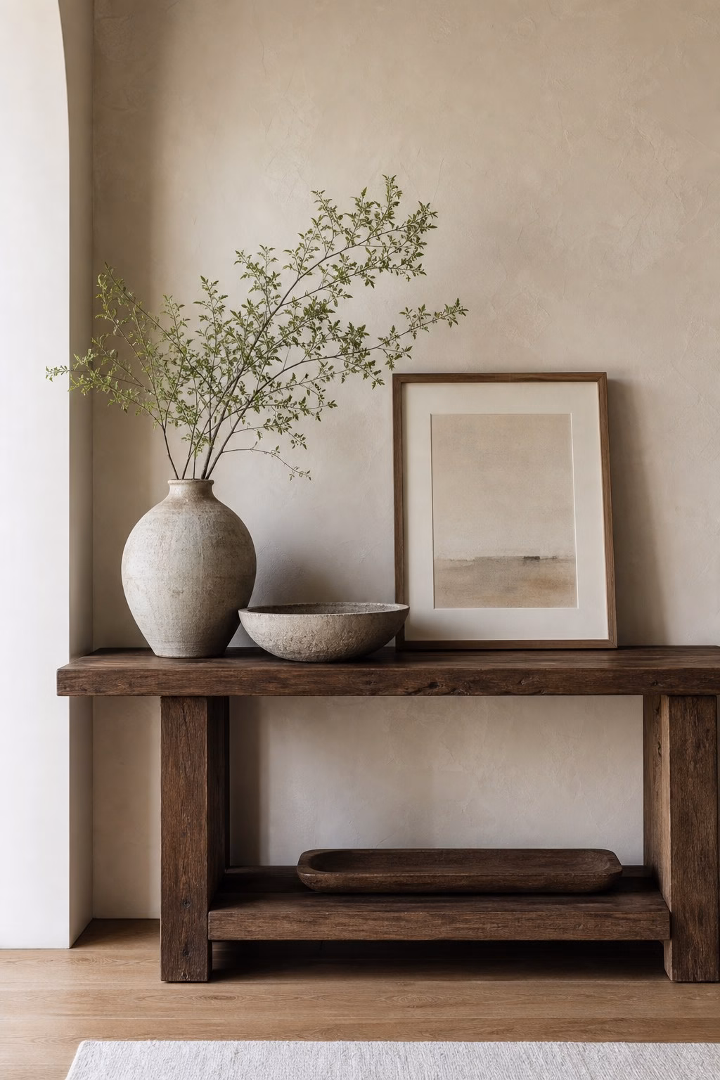 Large artisan ceramic vessel replacing small accessories on a console
