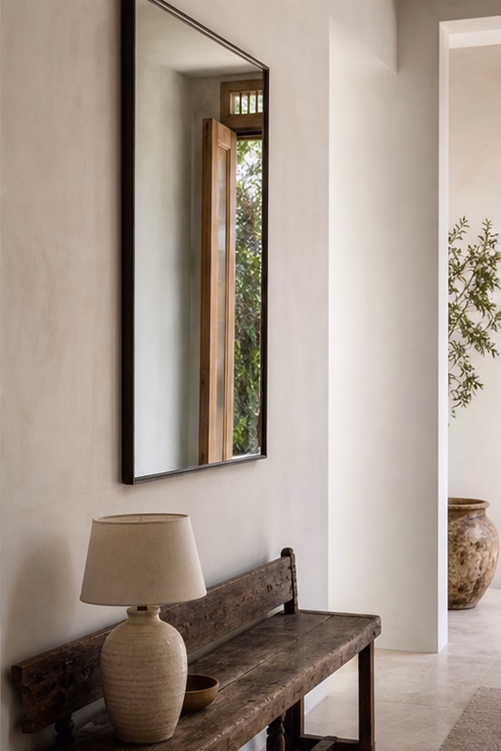 Vintage wood bench adding character to a clean modern entry