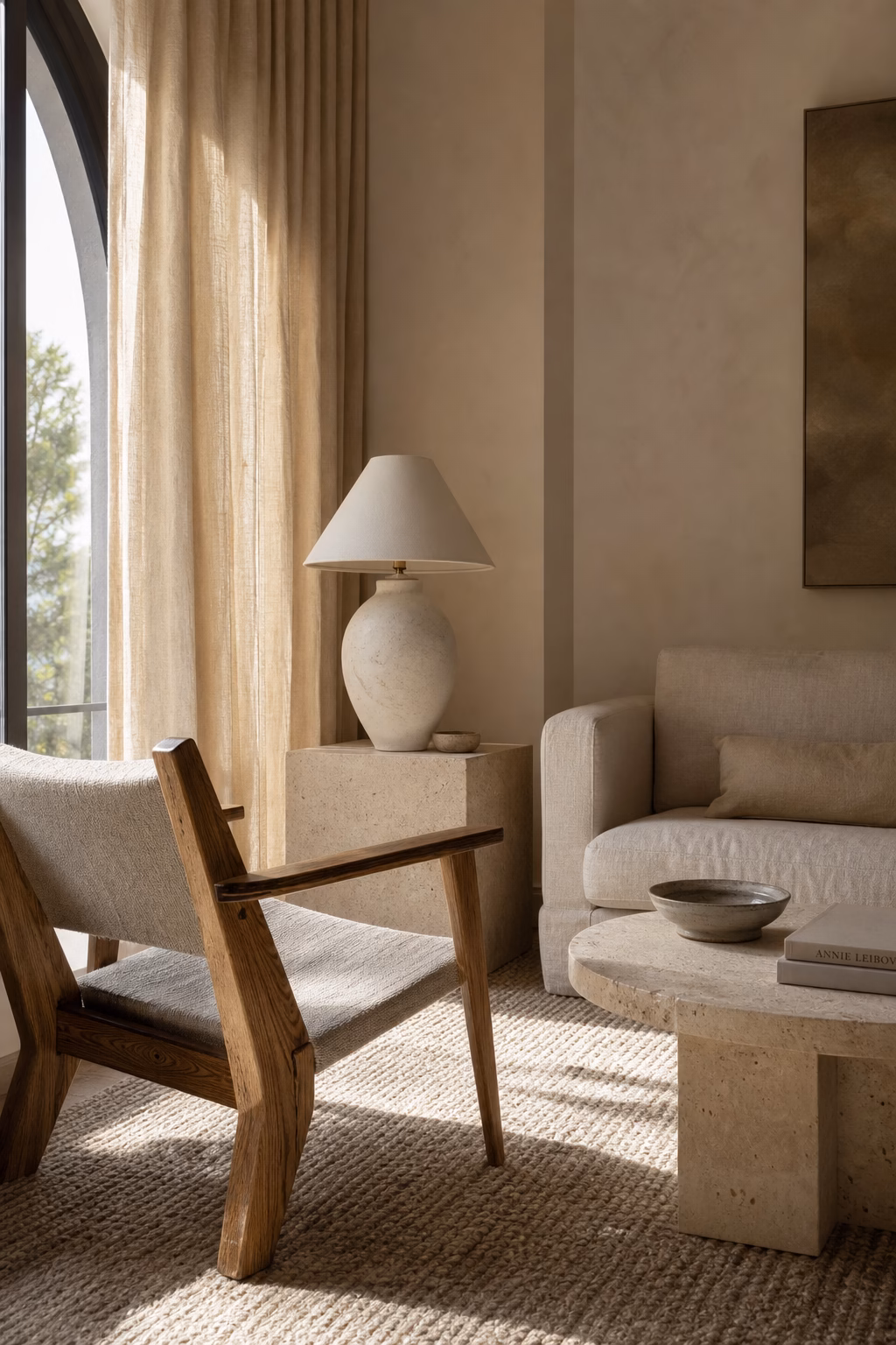 Minimal living room warmed with linen wool wood stone and ceramic textures