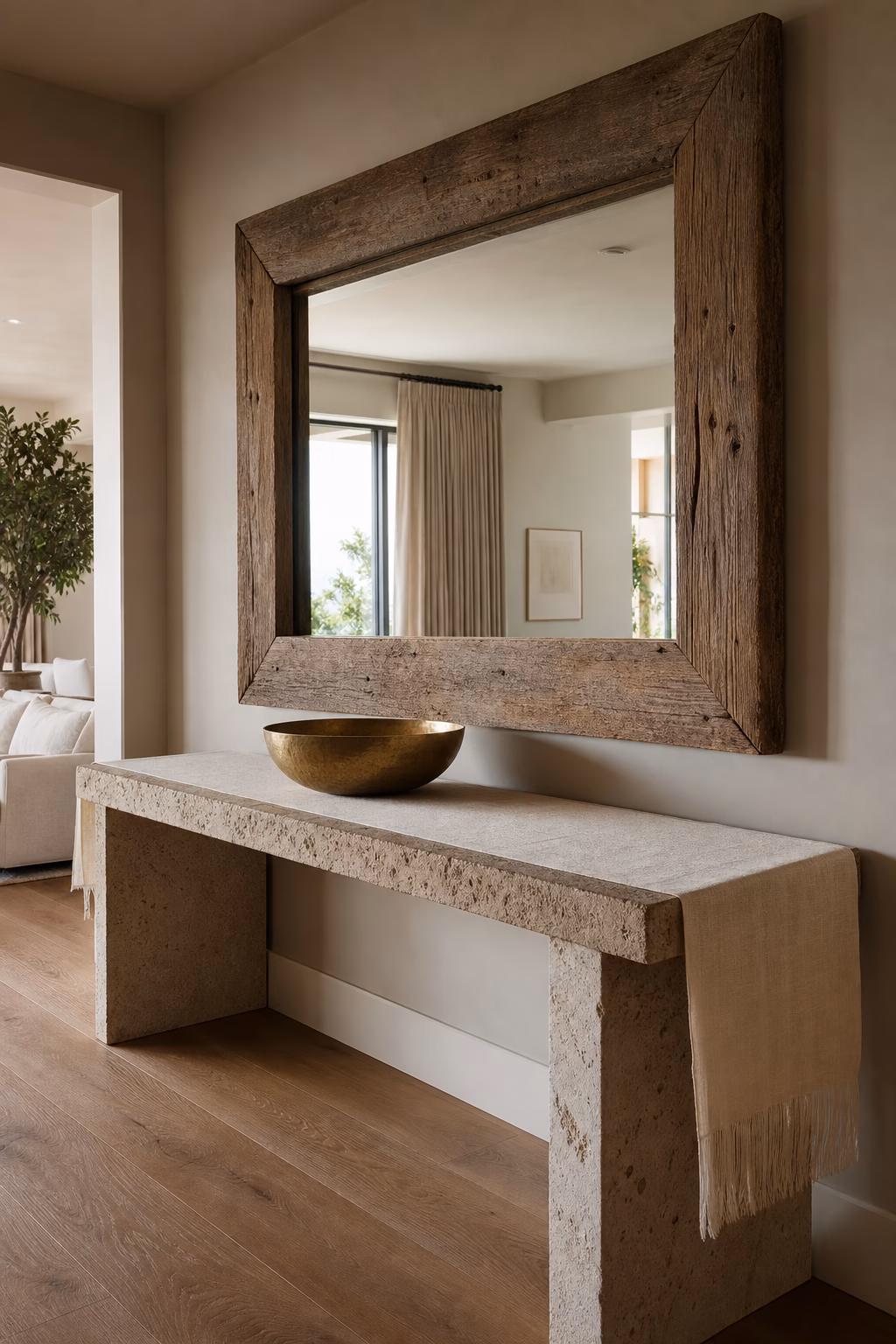 Chunky reclaimed wood mirror frame adding rustic weight to an entry