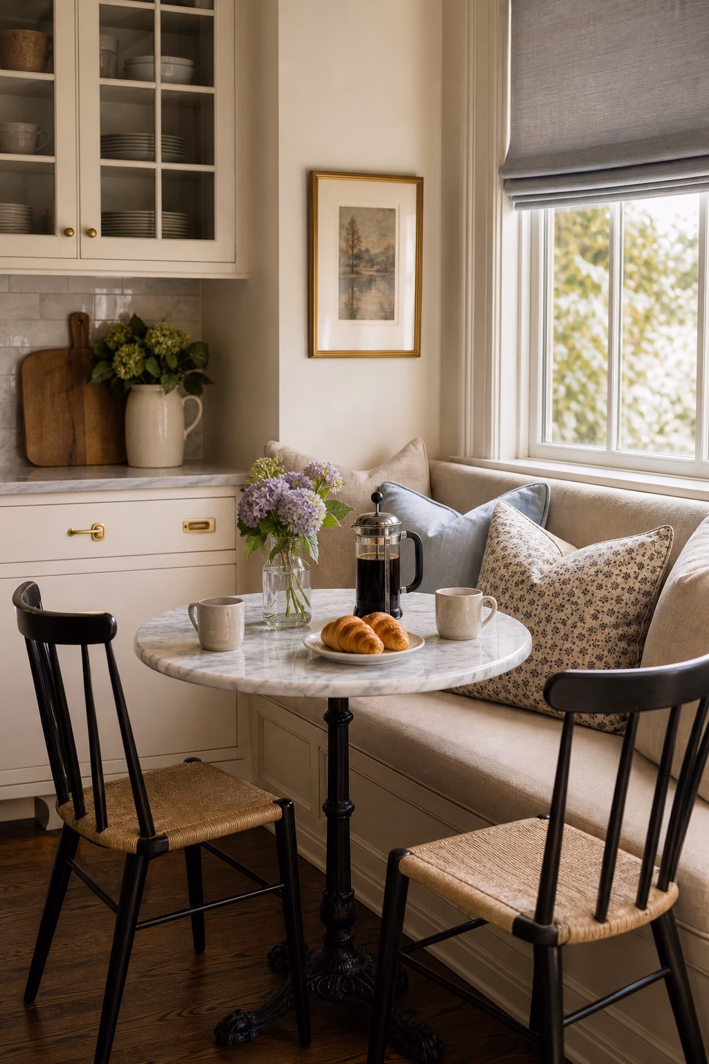 Breakfast nook with a marble-top bistro table for a polished look.