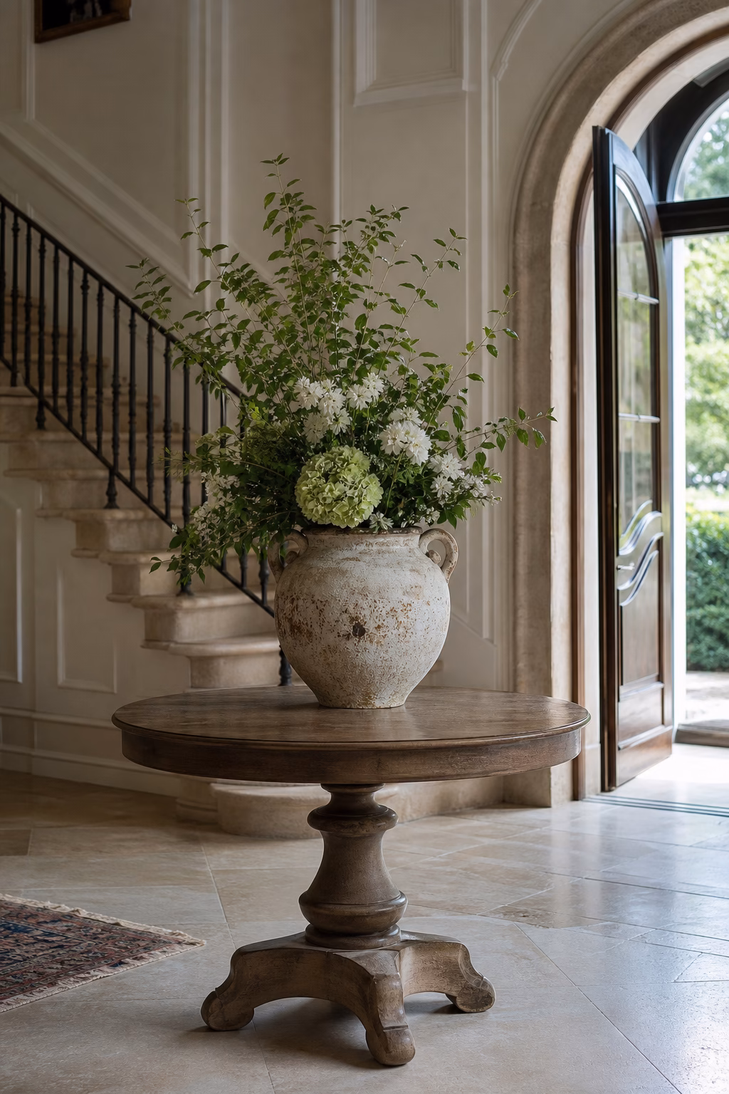 Vintage ceramic vase adding character to a mantel with fresh stems