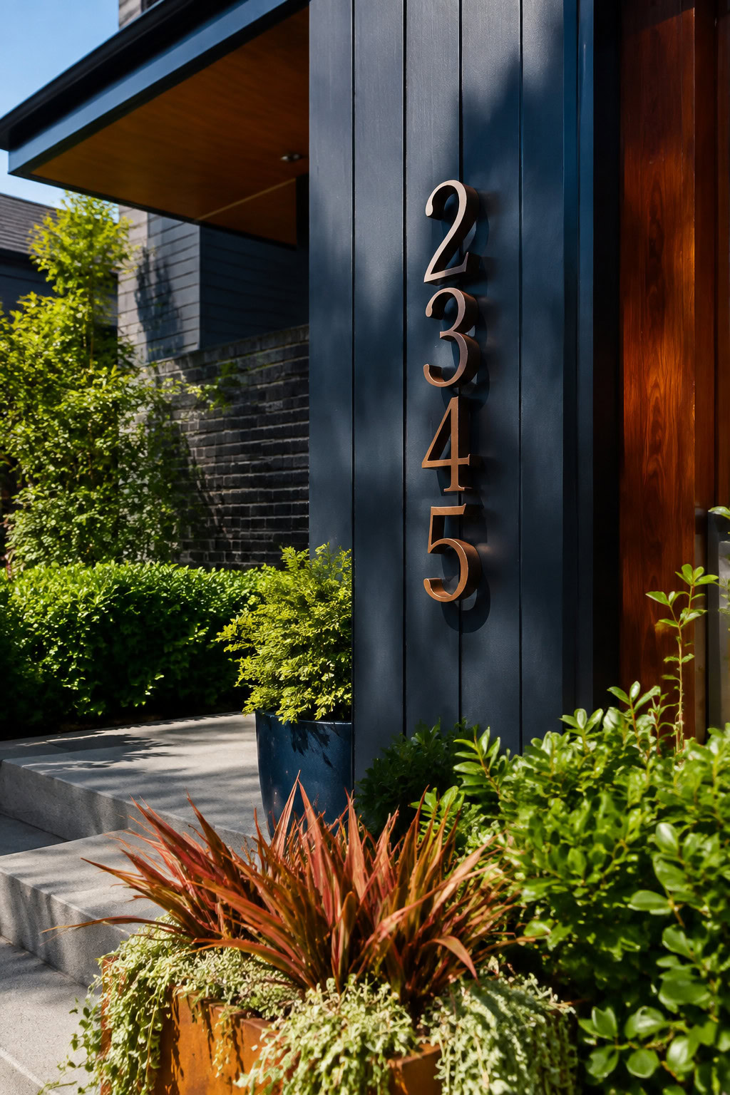 Artistic copper and black metal house-address detail